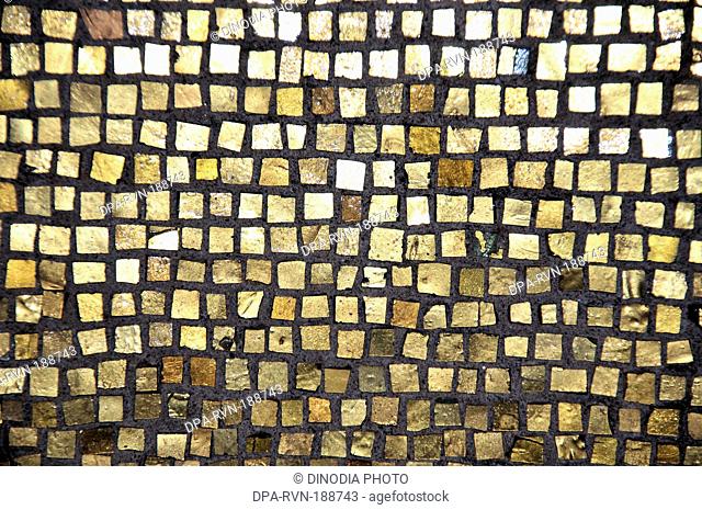 gold mosaic tiles wall Stockholm sweden