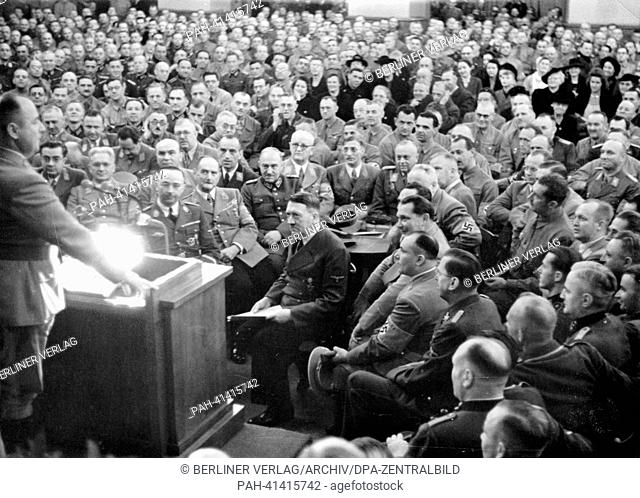 The image from the Nazi Propaganda! shows Adolf Hitler among his ""old comrades"" during an hour of commemoration on the occasion of the anniversary of the Beer...