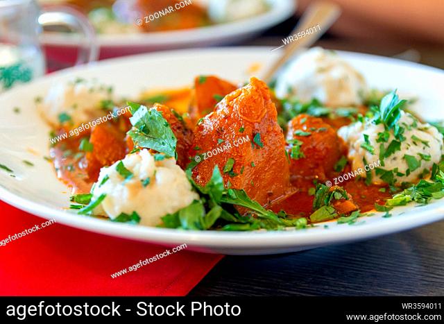 Eating vegetable pumpkin goulash in a austrian or german restaurant