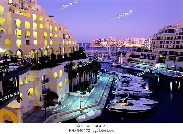 Portomaso Marina at dusk with Hilton Hotel, Paceville, St. Julian`s, Malta, Mediterranean, Europe