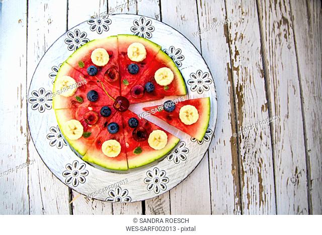 Watermelon pizza, banana, blueberries, cherries, mint