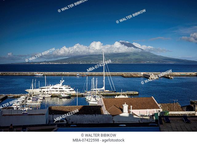 Portugal, Azores, Faial Island, Horta, elevated view of waterfront and Pico Volcano