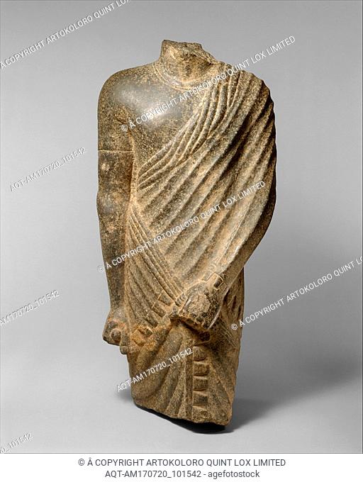 Torso of a Striding Draped Male Figure, Ptolemaic or Roman Period, 304 B.C.â€“A.D. 364, From Egypt, Diorite or gabbro, H