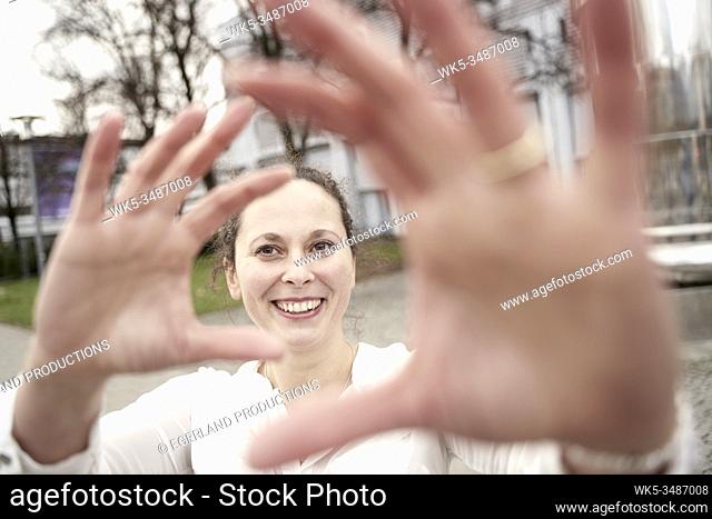 woman framing happiness