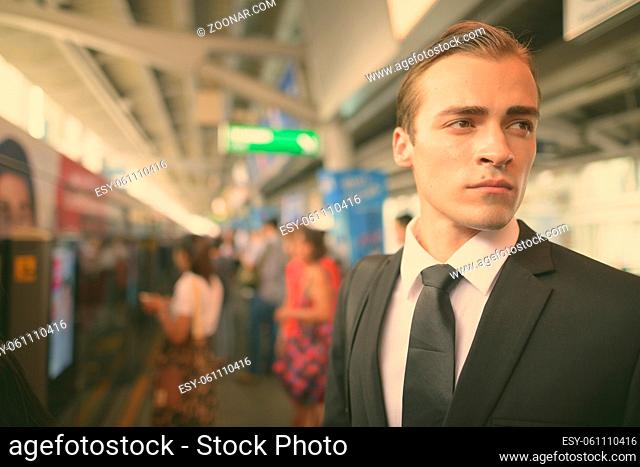 Portrait of young businessman exploring the city of Bangkok, Thailand