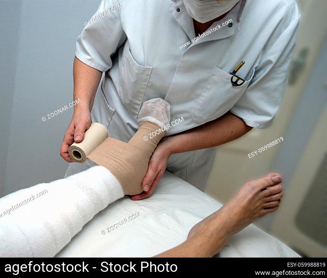 woman getting support bandage in hospital