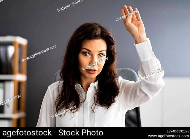 Woman Raising Hand In Training Video Conference Call