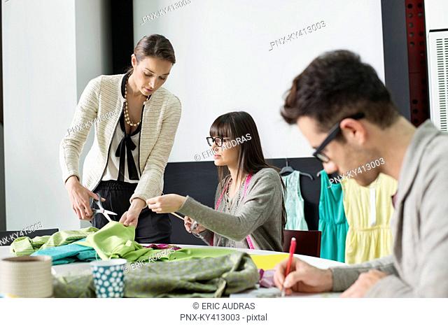 Fashion designers working in an office
