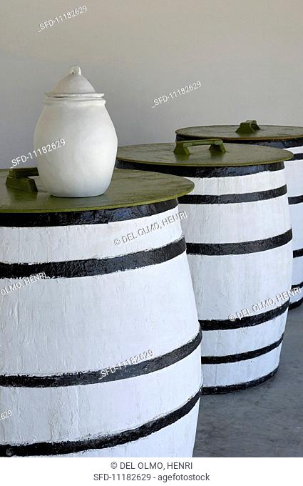 Olive oil in casks and in a white pitcher (Tunisia)