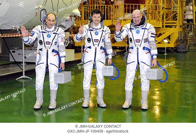 At the Baikonur Cosmodrome in Kazakhstan, the three crew members who will round out the Expedition 30 crew on the International Space Station pose for pictures...