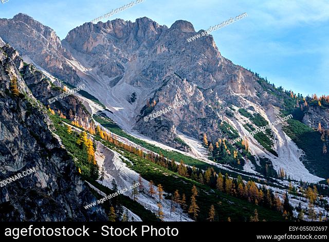 Colorful autumn evening alpine rock scene. View from hiking path near lake Braies or Pragser Wildsee, South Tyrol, Dolomites Alps, Italy