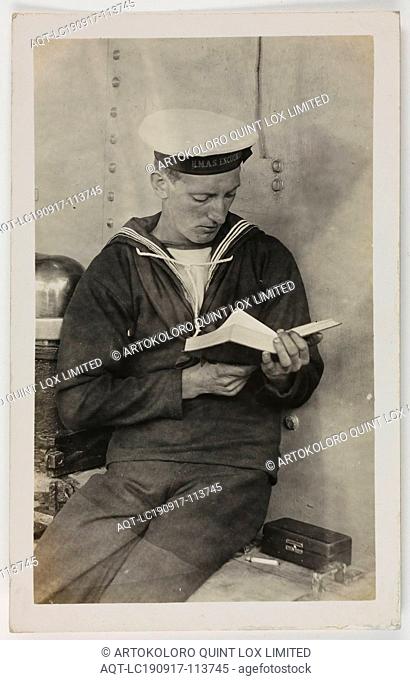 Photograph - HMAS Australia, Portrait of A Seaman Reading, 1914-1918, One of 63 postcards contained in an album that was owned by Cliff Nowell
