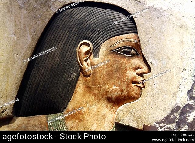 Close view of an ancient Egyptian carved painting on a wall