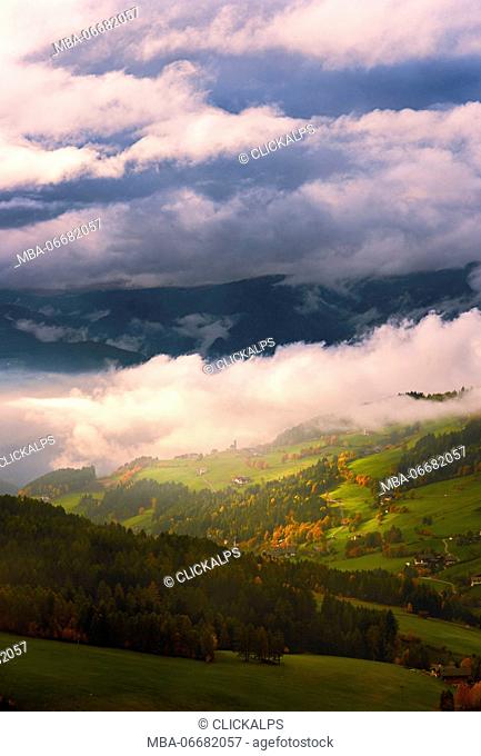 Italy, South Tyrol, Bolzano district, Funes Valley - autumn colors in a stormy day