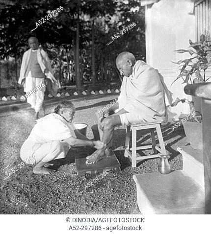 Kasturba Gandhi washing her husband's feet. Bardoli. Gujarat. India. 1939