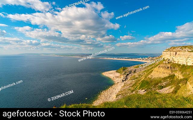 South West Coast Path on the Isle of Portland, looking towards Fortuneswell and Chesil Beach with Weymouth in the background, Jurassic Coast, Dorset, UK