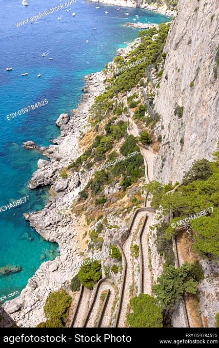 Rocky shoreline on the Tyrrhenian Sea nearby Marina Piccola, view of the footpath Via Krupp, Capri Island, Italy
