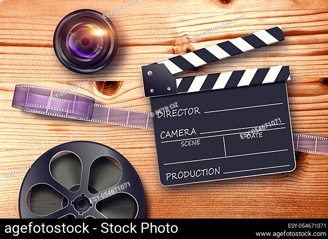 Film reel, lens and movie clapper in retro composition