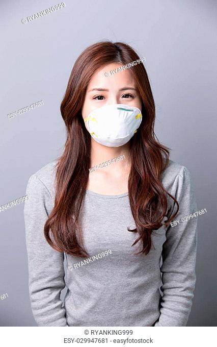 A Woman wears a mask, illness, asian