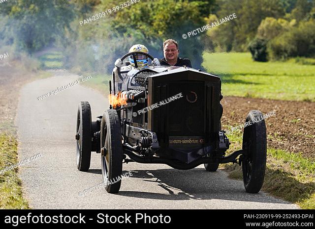 19 September 2023, Baden-Württemberg, Sinsheim: Former racing driver Leopold Prince of Bavaria (l) rides in the ""Brutus"" racing car with an assistant at the...