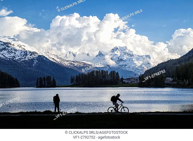 Silhouette of people on the shore of Lake Silvaplana Canton of Graubünden Maloja Engadine Switzerland Europe