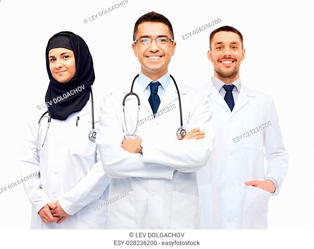 medicine, healthcare and people concept - happy smiling doctors in white coats with stethoscopes