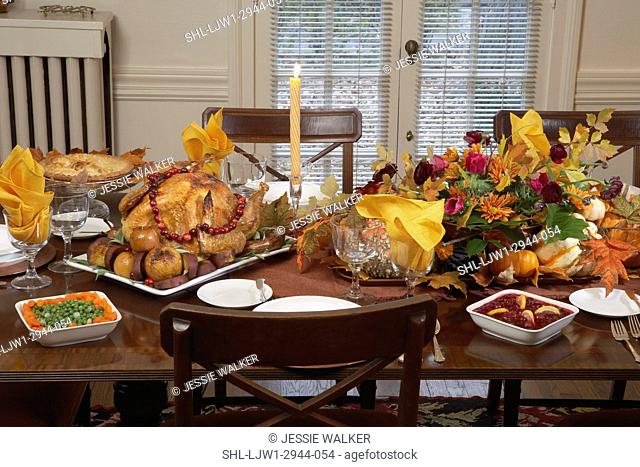 Fall Food Theme: Thanksgiving table close up, Flower arrangement, turkey, cranberries
