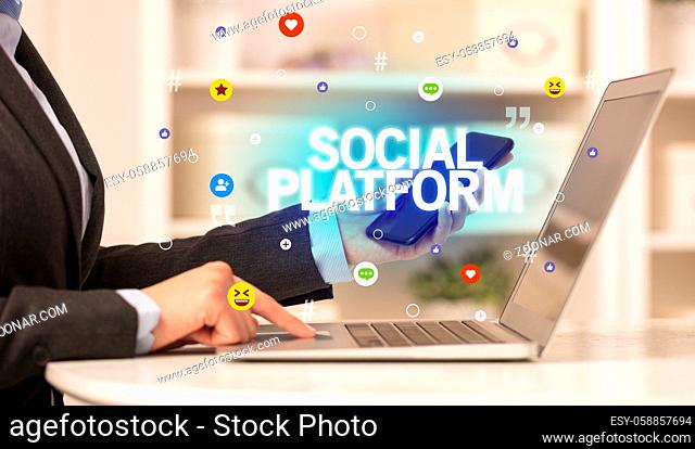 Freelance woman using laptop with SOCIAL PLATFORM inscription, Social media concept