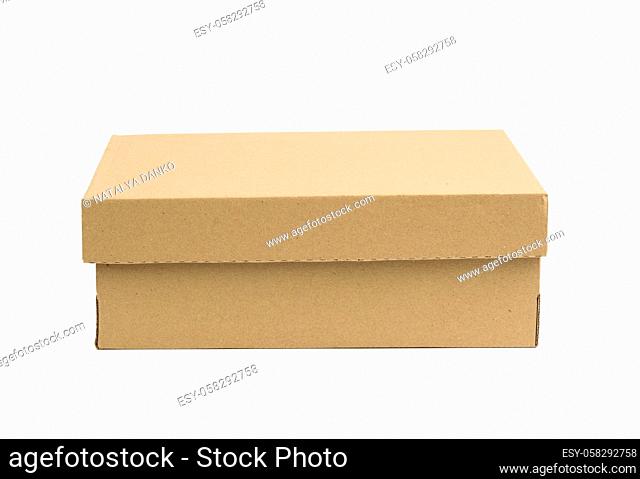 closed cardboard rectangular box made of corrugated brown paper isolated on a white background