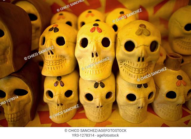 Ceramic skulls sit for sale ahead of Day of the Dead celebrations in a shop at the Jamaica Flower Market in Mexico City