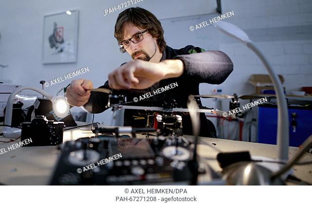 Development engineer for drones, Gerd Jacobs, works on the propeller of quadrocopter, a drone powered by four propellers, at the workshop of Cooper Copter