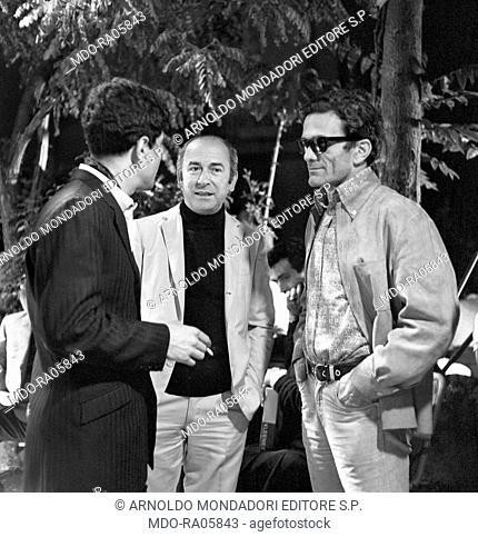 Italian writer and director Pier Paolo Pasolini talking to Italian actor Ninetto Davoli on the set of the film Ostia directed by Sergio Citti. 1970