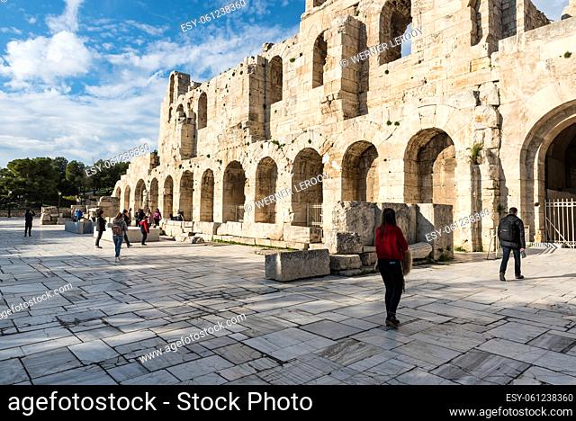 Athens Old Town, Attica, Greece - 12 28 2019 Tourists walking around the theater at the Acropolis