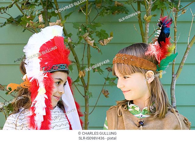 Two girls in Native American costumes