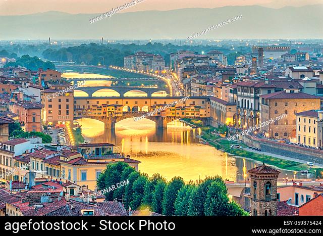 Florence sunset city skyline and Ponte Vecchio Bridge, Florence, Italy