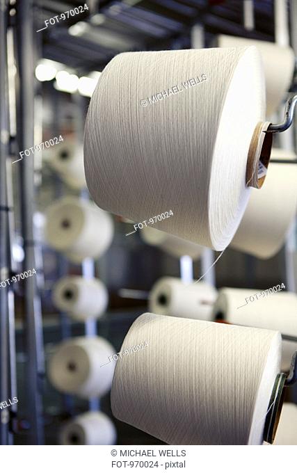 Large spools of white string