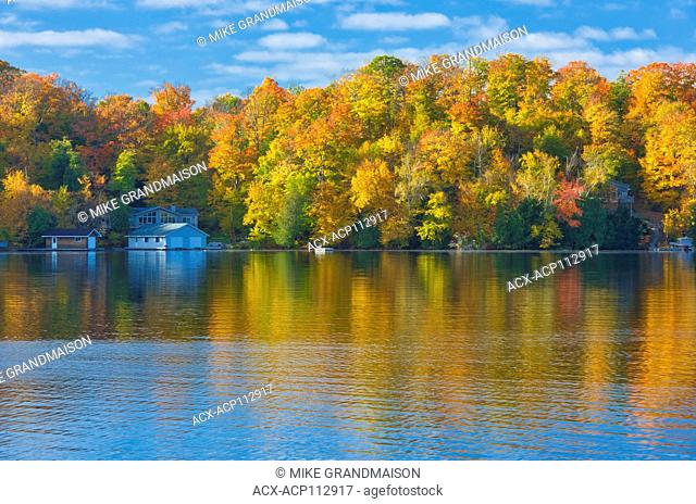 Horseshoe Lake in autumn with cottage , Near Parry Sound, Ontario, Canada