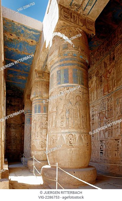 EGYPT, LUXOR, 29.03.2010, colorful columns and bas-relief of western colonnade inside second yard of Mortuary Temple of Ramesses III at Medinet Habu, Luxor