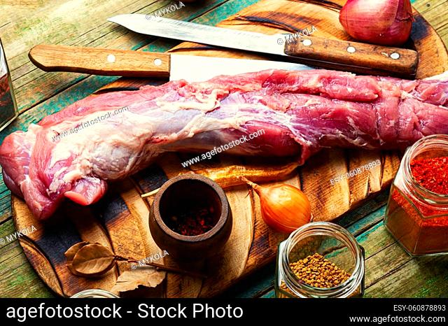 Appetizing raw pork meat for cooking. Raw meat and spices set