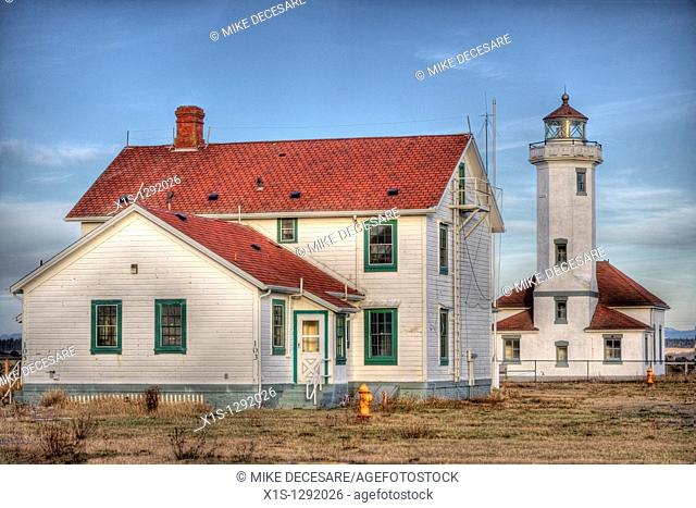 Point Wilson Lighthouse and barracks buildings at golden hour