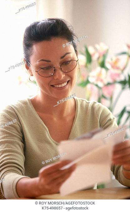 Woman reading correspondence