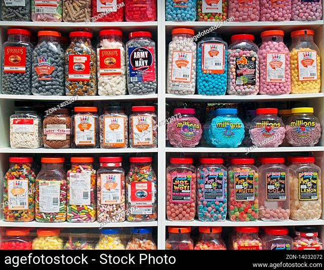 southport, merseyside, united kingdom - 28 june 2019: jars of old fashioned traditional british sweets in on display in the window of a shop