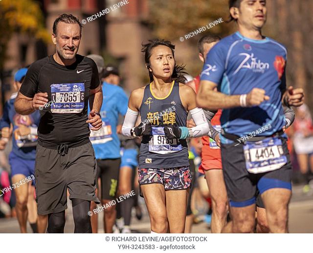 Runners pass through Harlem in New York near the 22 mile mark near Mount Morris Park on Sunday, November 4, 2018 in the 48th annual TCS New York City Marathon
