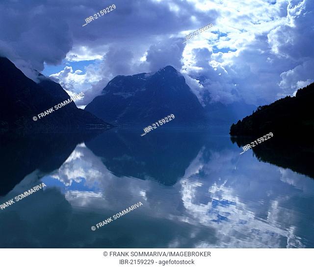 Reflection and a cloudy mood at Lake Strynsvatn, Strynevatnet, near Stryn, Sogn og Fjordane, Norway, Scandinavia, Europe