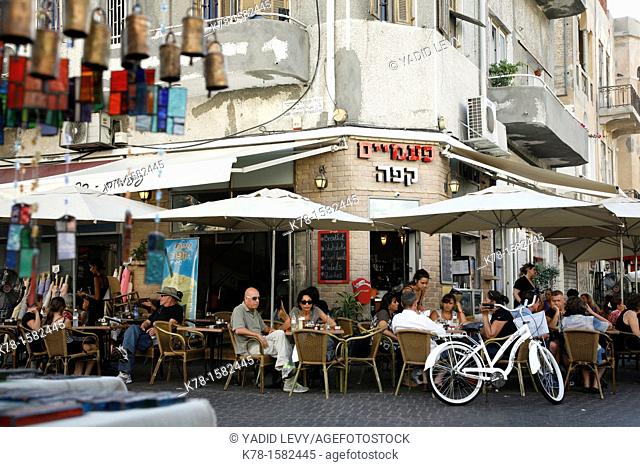 People sitting at a a cafe in Nachalat Binyamin Street, Tel Aviv, Israel