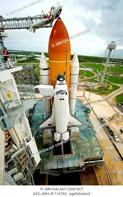 The space shuttle Atlantis is revealed as the rotating service structure (RSS) is rolled back at pad 39a on Thursday, July 7