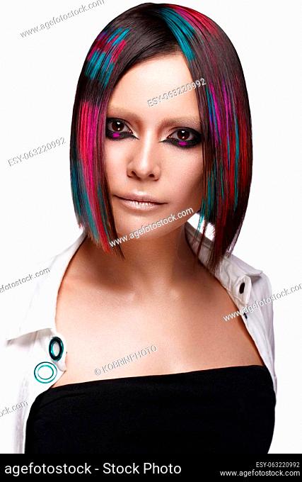 Portrait of beautiful woman with multi-colored hair and creative make up and hairstyle