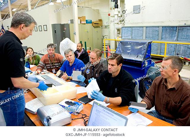 STS-134 crew members participate in an EVA Thermal Protection System (TPS) overview training session in the TPS Precision Air Bearing Facility in the Space...