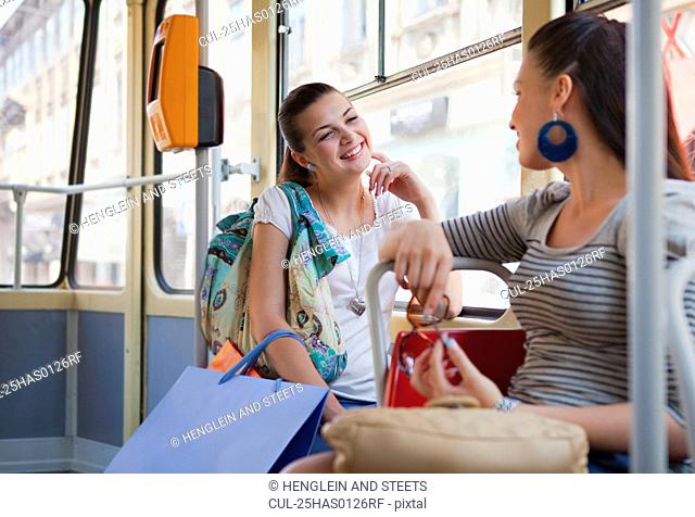 Young women talking in tram train