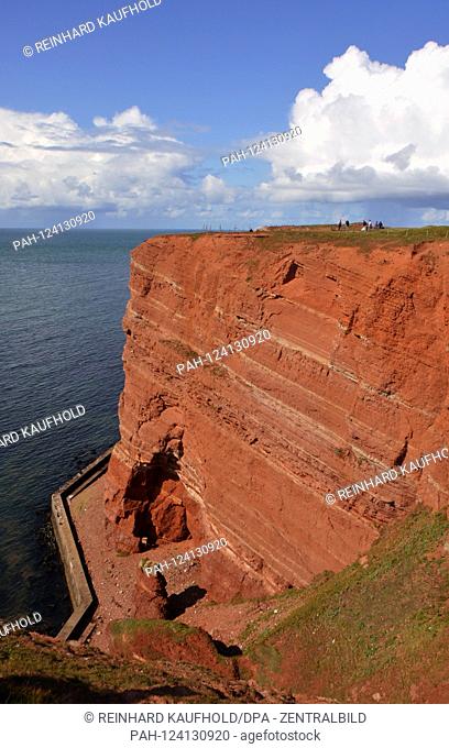 View of the ocher-red rocky coast (Buntsandstein) in the west of the North Sea island Helgoland, recorded on 07.09.2019 | usage worldwide
